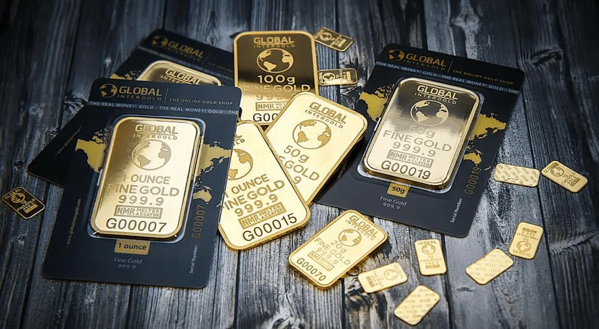 Vàng giảm do USD mạnh và kỳ vọng Fed nâng lãi